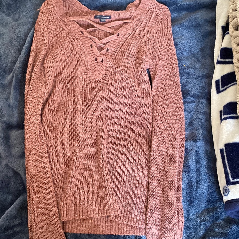 Lightly used long sweater. Looks more red on camera and purple in person.